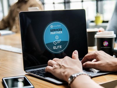 Woman at laptop in meeting